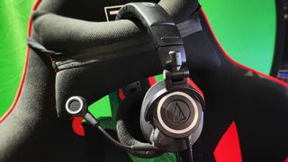 Audio-Technica ATH-M50xSTS StreamSet gaming headset on a chair