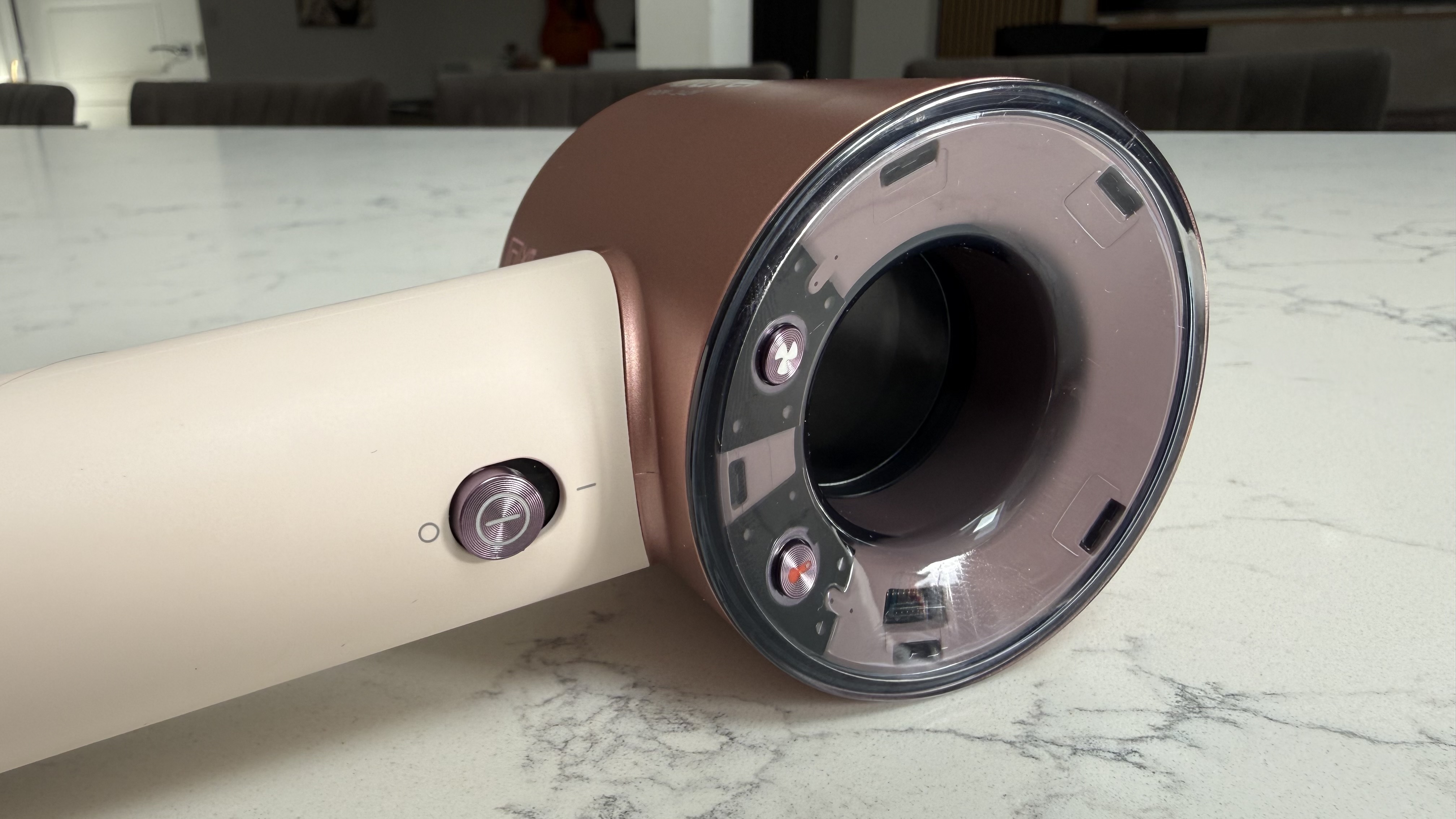 Dyson Supersonic Travel hair dryer showing the controls and hollow motor design