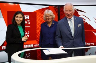 Prince Charles, Prince of Wales and Britain's Camilla, Duchess of Cornwall talk with BBC Afghan Senior Presenter Sana Safi during their visit to the BBC World Service, in London, on April 28, 2022, for its 90th anniversary. - During the visit the royal couple thanked staff and learn how BBC journalists are continuing their operations across Ukraine, Russia and Afghanistan.