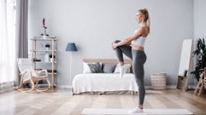 Woman working out in her bedroom