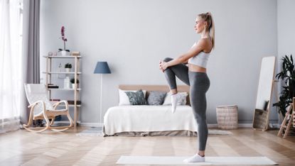 Woman working out in her bedroom