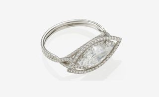 Exquisite marquise-cut diamond within a micro pavé set circular-cut diamond surround
