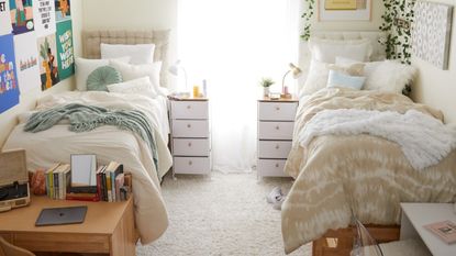 Dorm with two beds and white decor