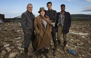 Vera cast stand together