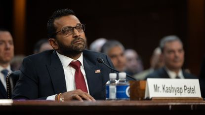 Kash Patel listens during his Senate hearing to be FBI director on Jan. 30, 2025.