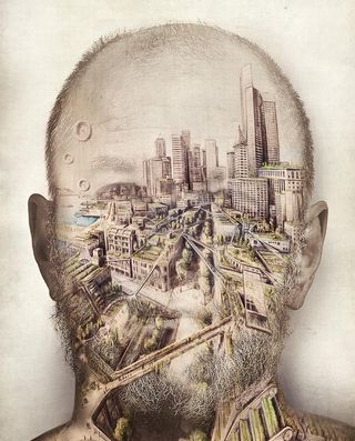 Man's head with city drawing inside