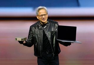 Nvidia CEO Jensen Huang holding hardware at GTC 2025