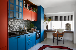 A bright toned kitchen with a corner office