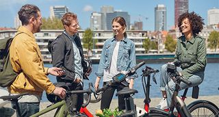 Image shows a group of people with Bosch electric bikes