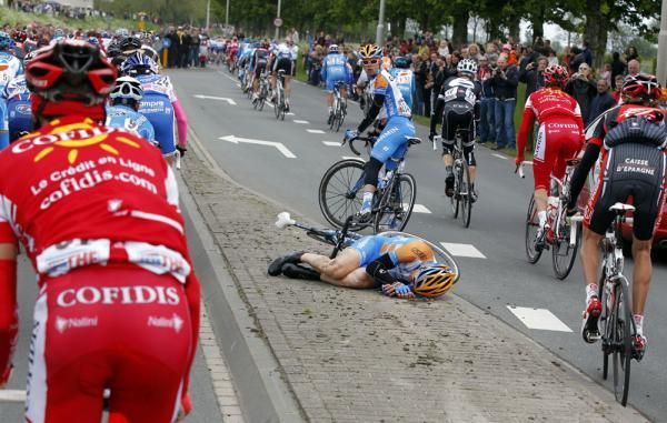 Jack Bobridge looks concerned as he waits for his Garmin-Transitions teammate Tyler Farrar to get up