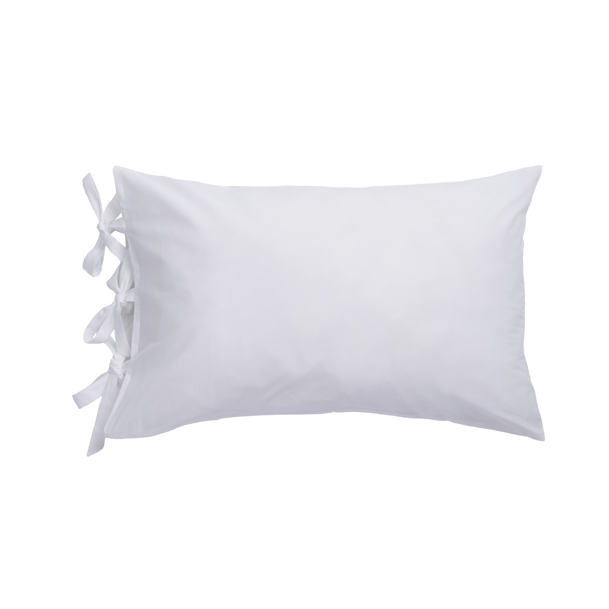 white pillow with bow ties on each end
