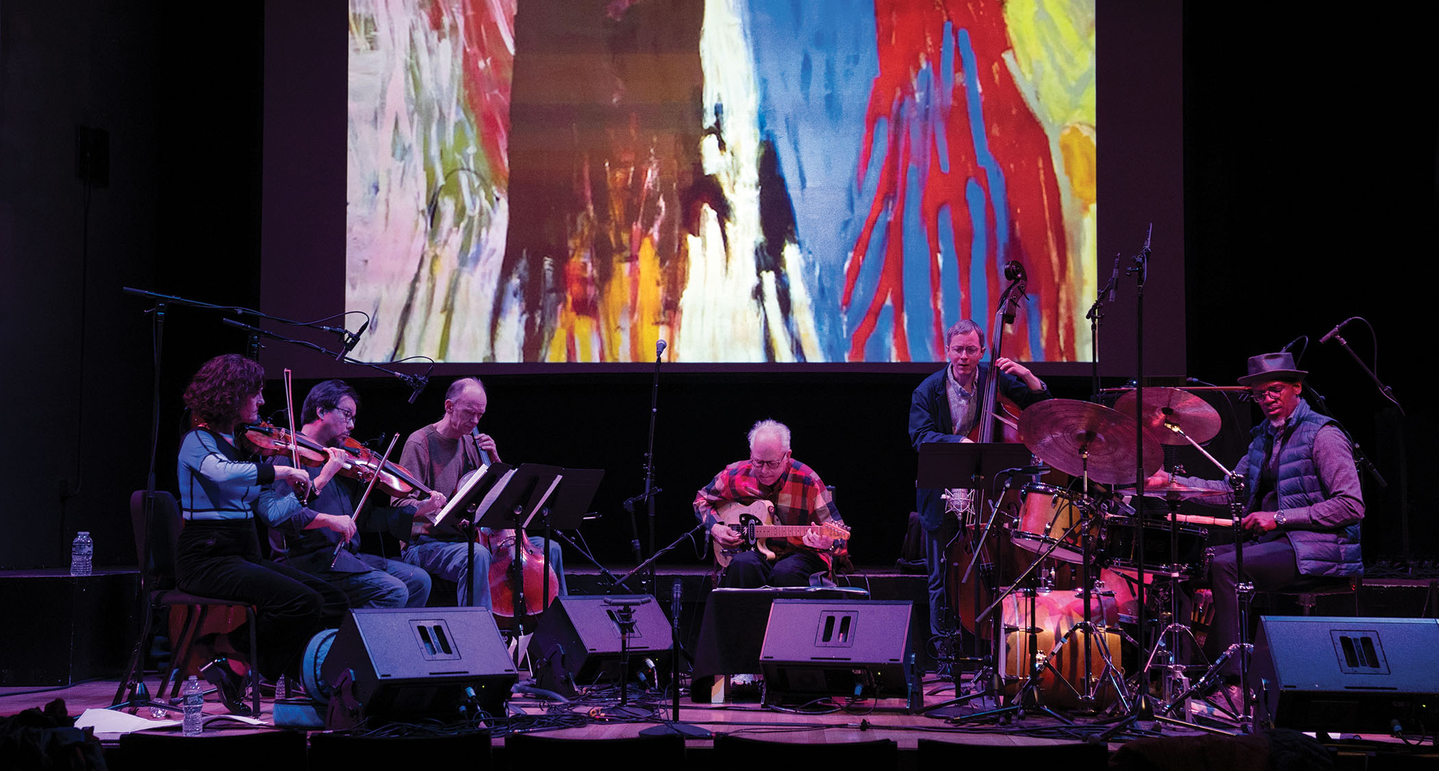 Bill Frisell in his element, onstage with a guitar