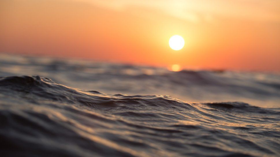 A view of the ocean at sunrise.