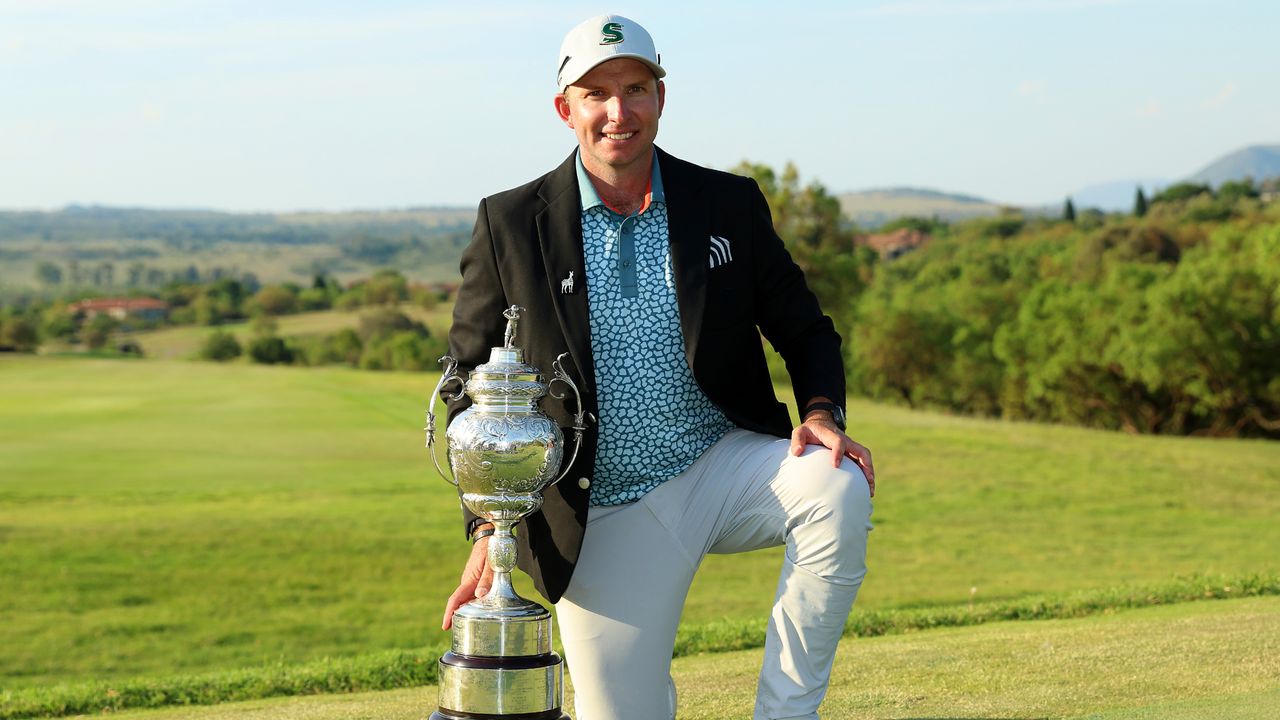 Dean Burmester with the Investec South African Open Championship trophy