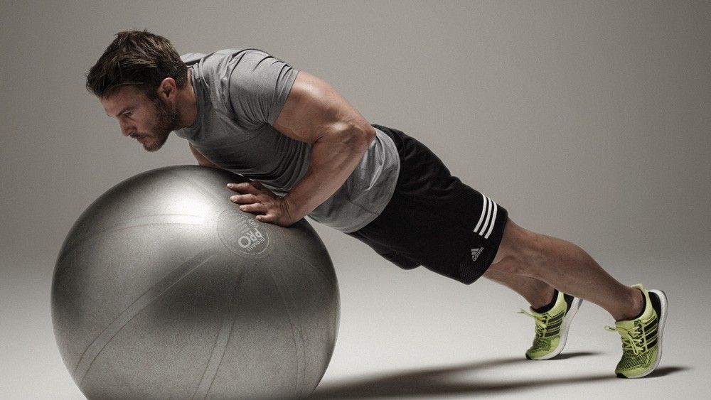 3 Strength Exercises You Can Do On An Exercise Ball (Chest Workout