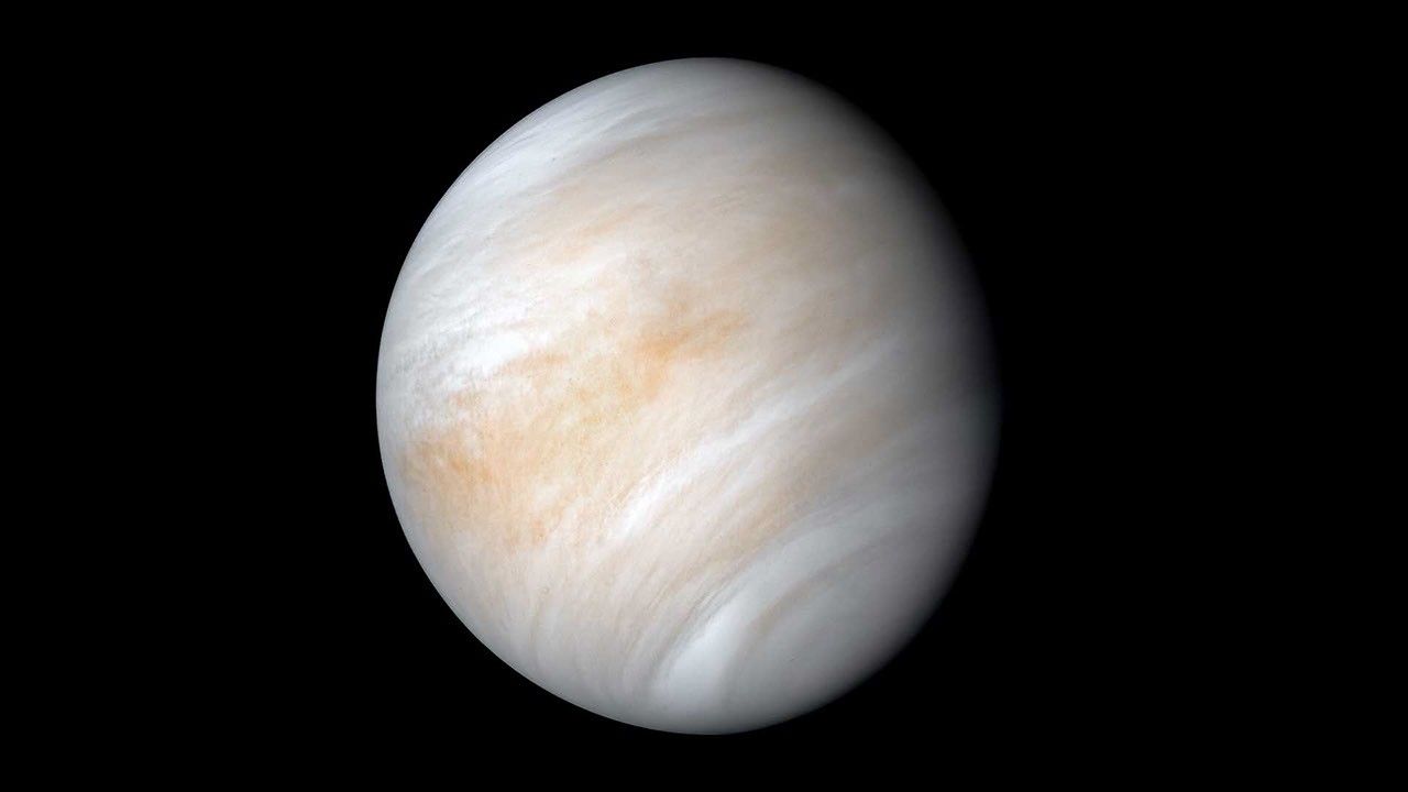A swirly yellowish white orb against a dark background.