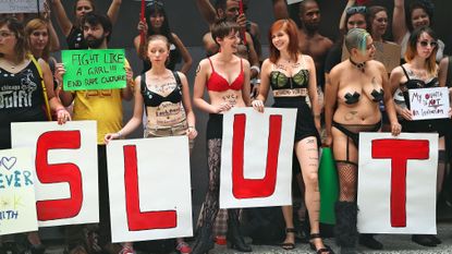 A group of women wearing very little in a public protest against slut shaming.