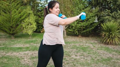 person doing dumbbell arms workout