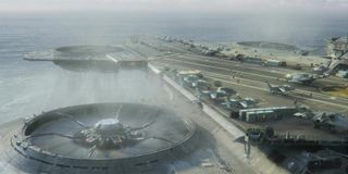 Military VTOL aircraft crowd the decks of the flying Helicarrier from the Avengers film