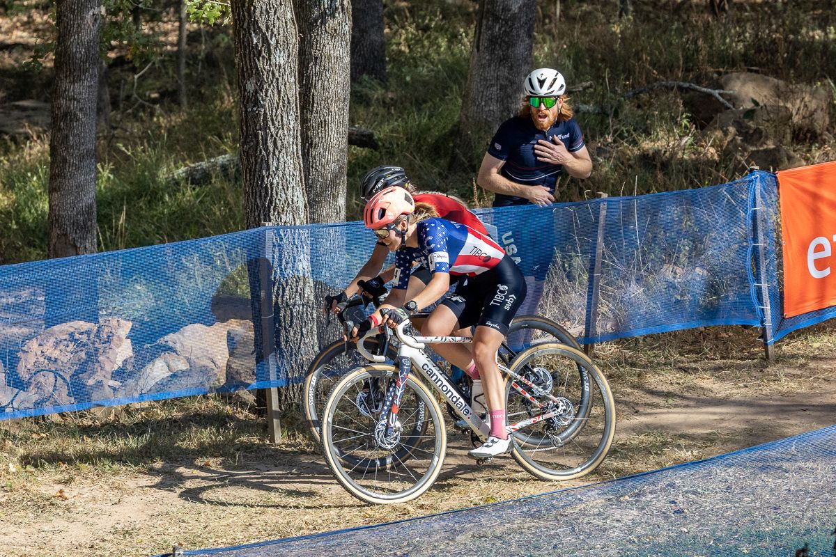 US National CX Coach Steven Hyde watches as Clara Honsinger (EF Education-TIBCO-SVB) and Inge Van Der Heijden (777) fight for position on the descent.