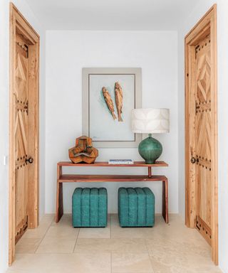 Modern entryway with statement art and console