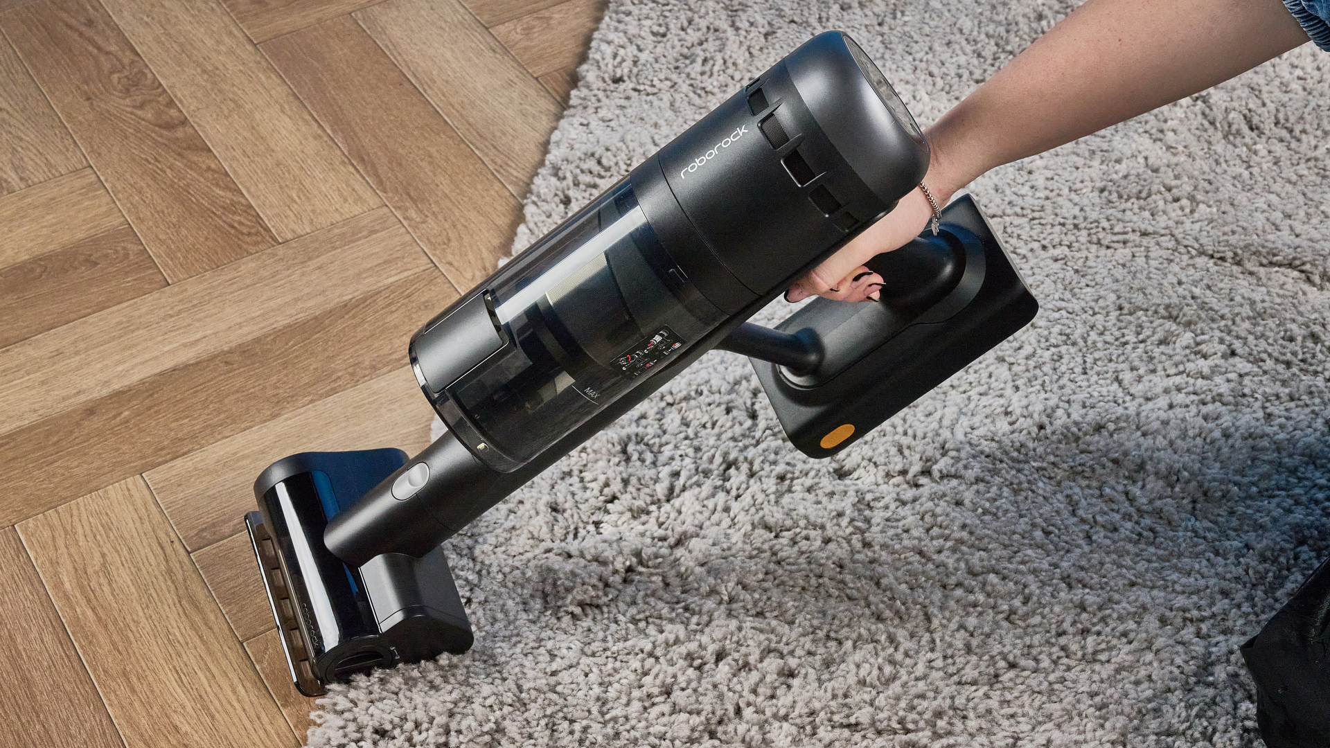 Roborock H60 Hub Ultra photograped in front f a blue background