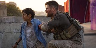 Rudhraksh Jaiswal and Chris Hemsworth in Extraction
