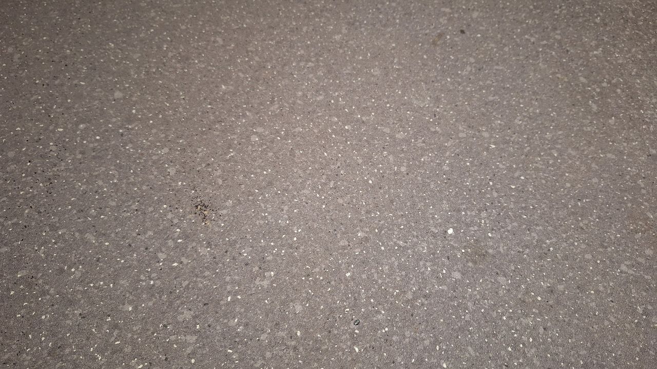 A few remnants of tea and oats on a lino floor after a single pass