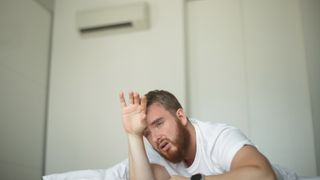 Man sweating upstairs with AC on