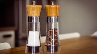 Salt and pepper grinders on a tabletop