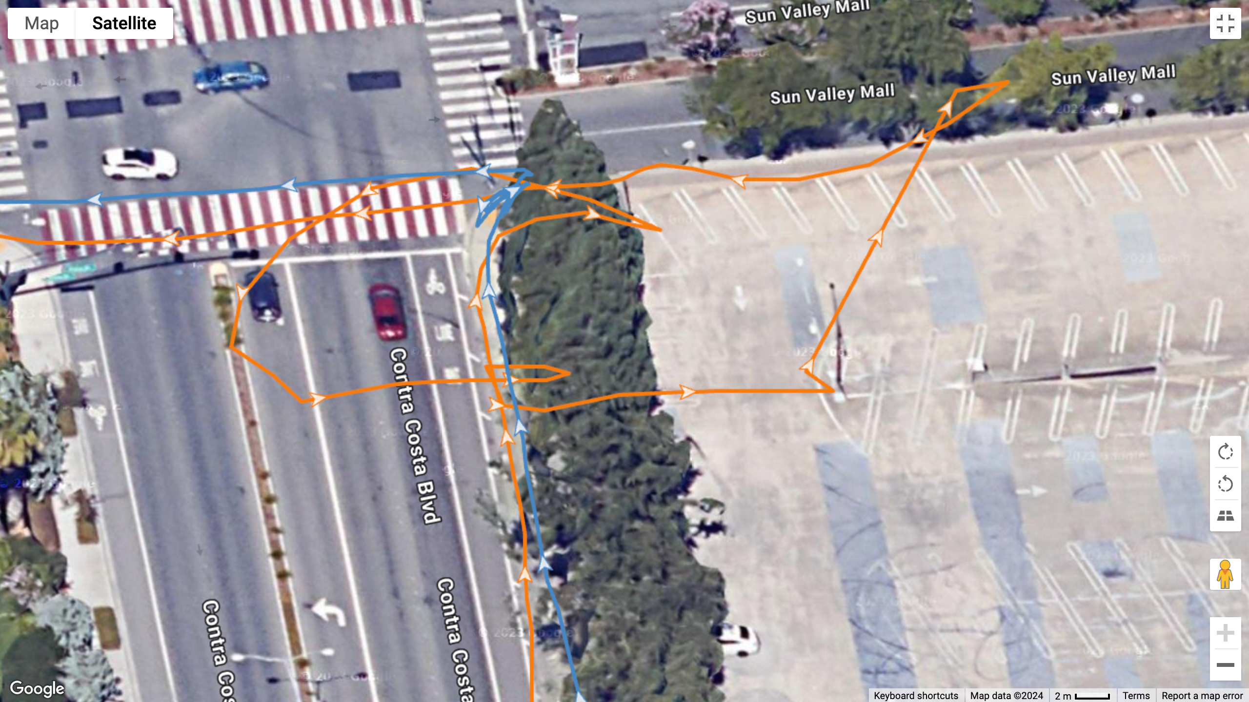 A GPS map showing how the Garmin Forerunner 965 (blue line) compares to the Pixel Watch 3 (orange line) for GPS accuracy. Garmin does significantly better, while Google strays off the track.