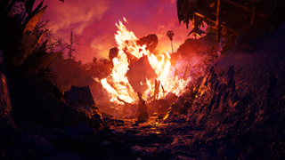 A character kneeling in front of a raging fire