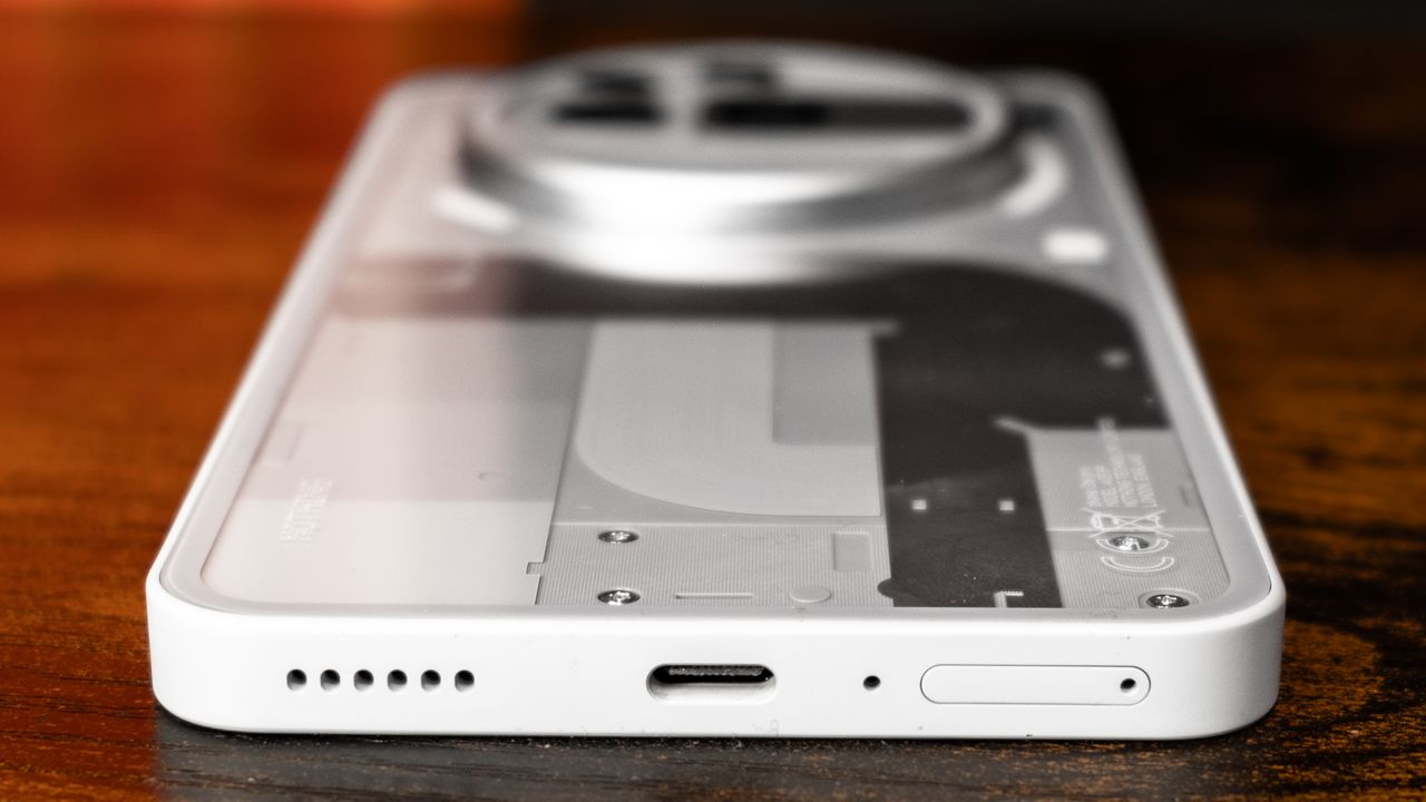 Nothing Phone 3a Pro back showing internals, camera bump, and USB-C port on bottom