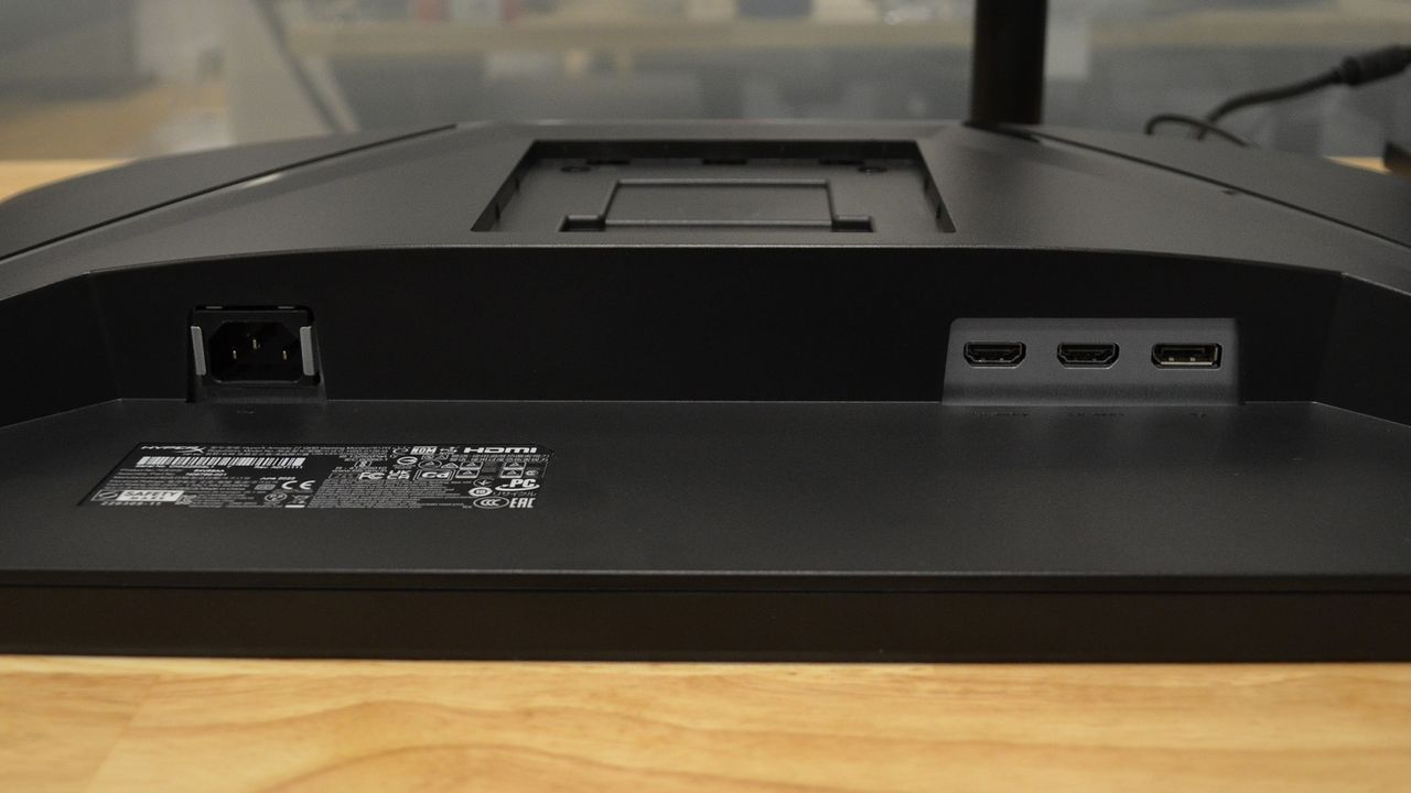 A HyperX Armada 27 on a wooden desk