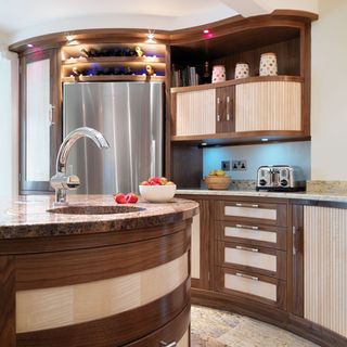 kitchen with fridge freezer and wooden cabinet