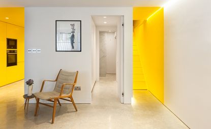 Apartment with yellow stairways and kitchen