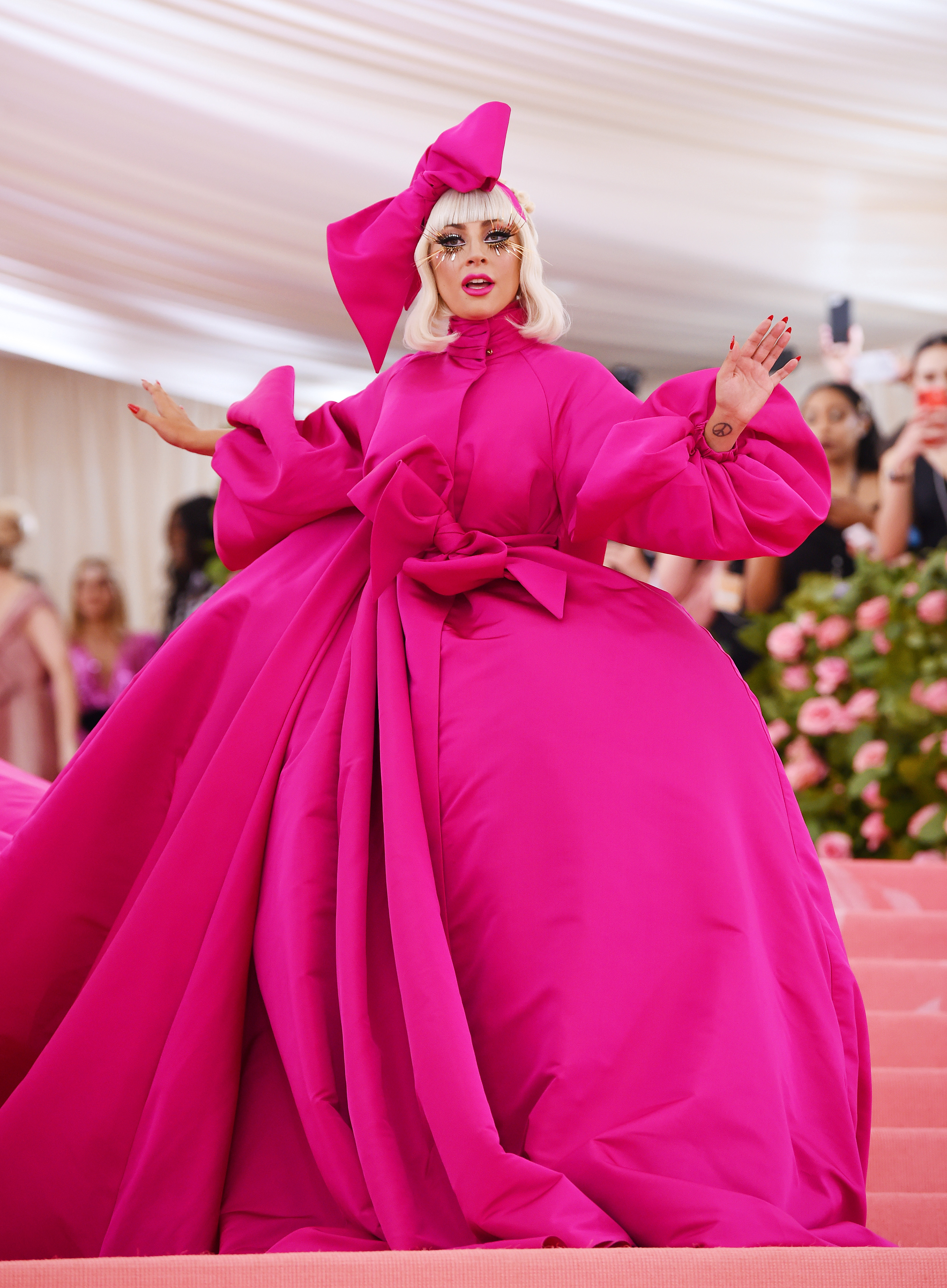 Lady Gaga wearing a bright pink Brandon Maxwell ball gown.