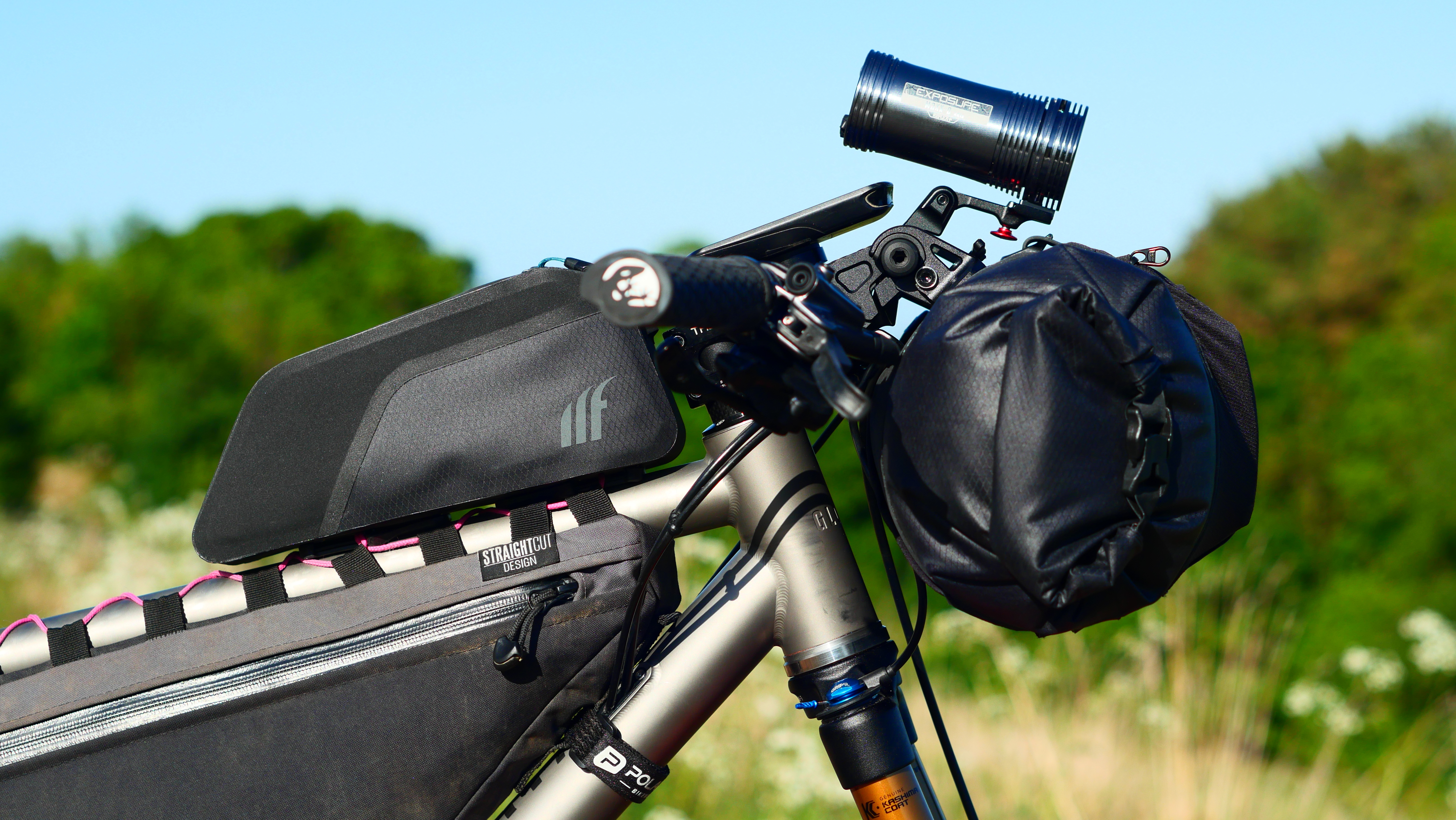 SQ Labs handlebar and tailfin handlebar bag fitted to a bikepacking bike