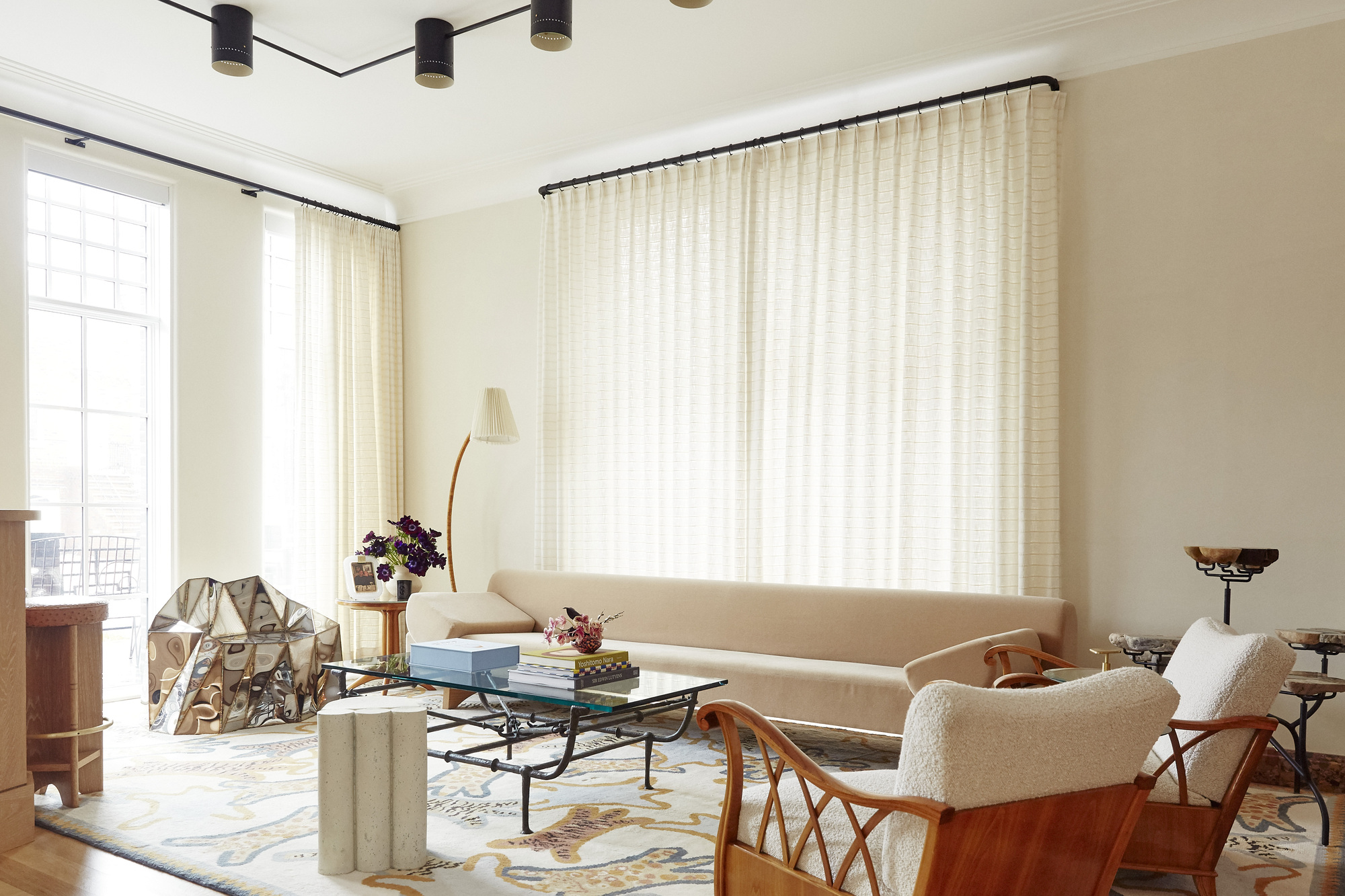 A modern living room with sheer curtains