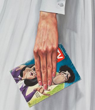 painting of woman's hand holding tv guide magazine