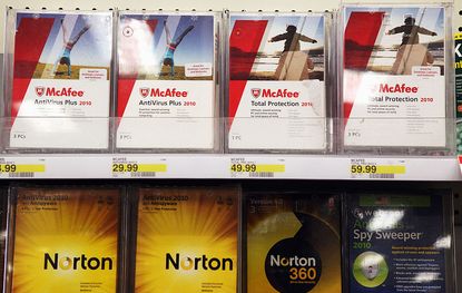 Boxes of McAfee security software displayed alongside Norton Anti-virus software