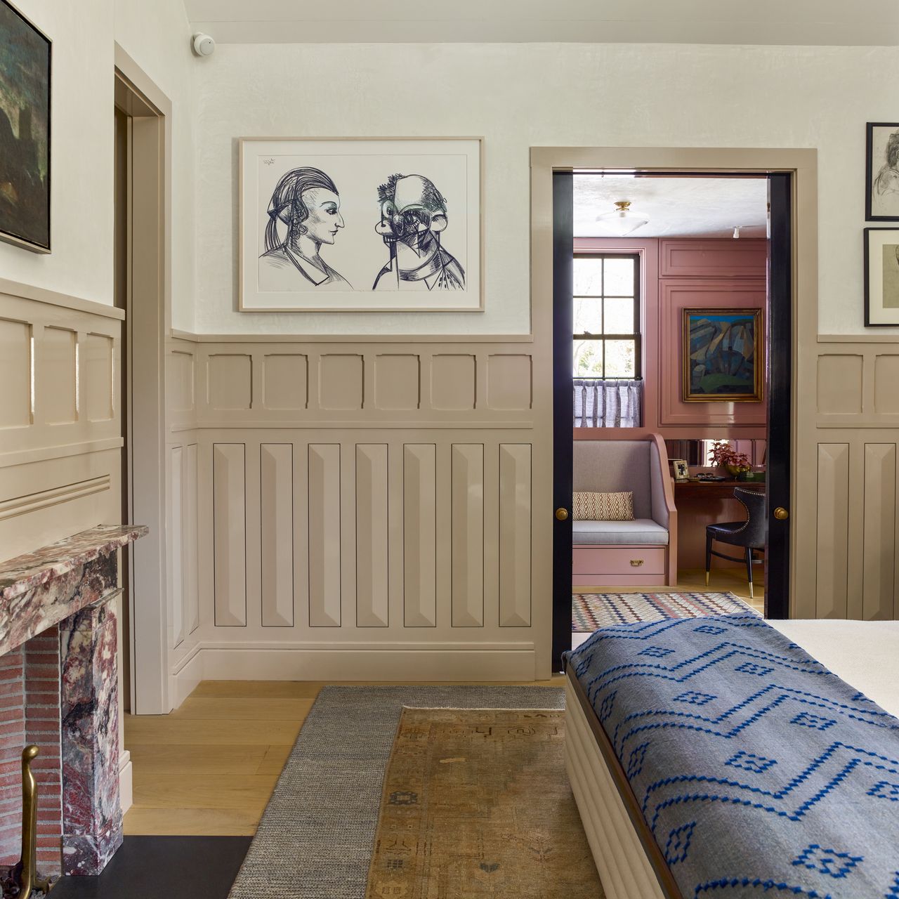 A beige Arts &amp; Crafts-inspired wainscoting wraps around a serene room.