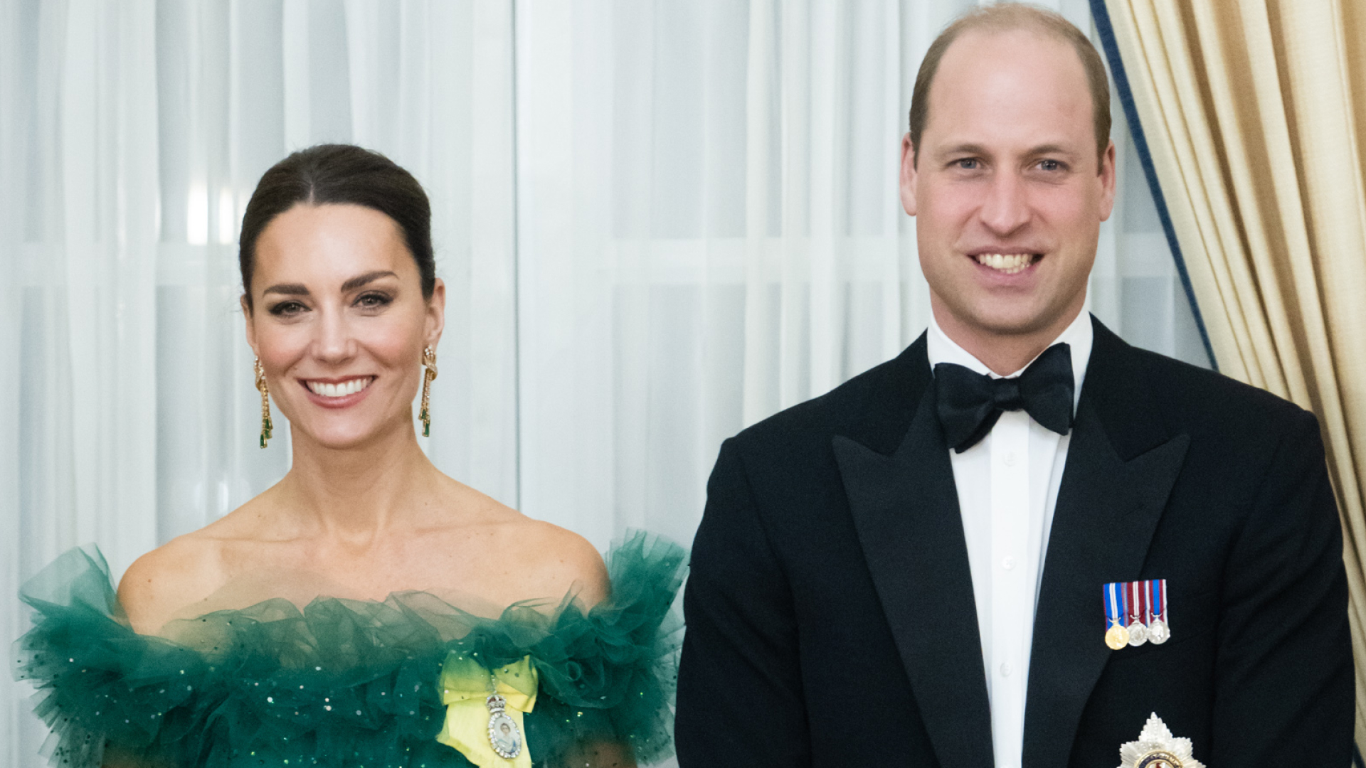 Kate Middleton wears a green ball gown to attend a dinner hosted by the Governor General of Jamaica at King's House on March 23, 2022