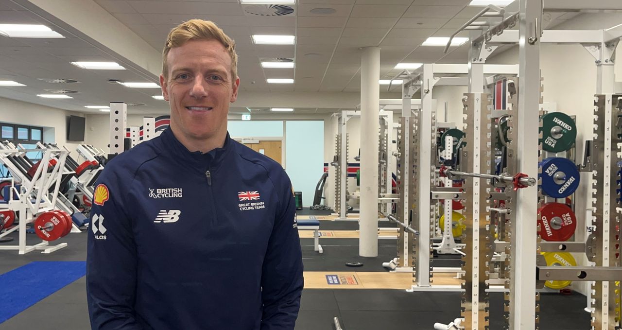 Peter Gascoigne stands smiling in the gym