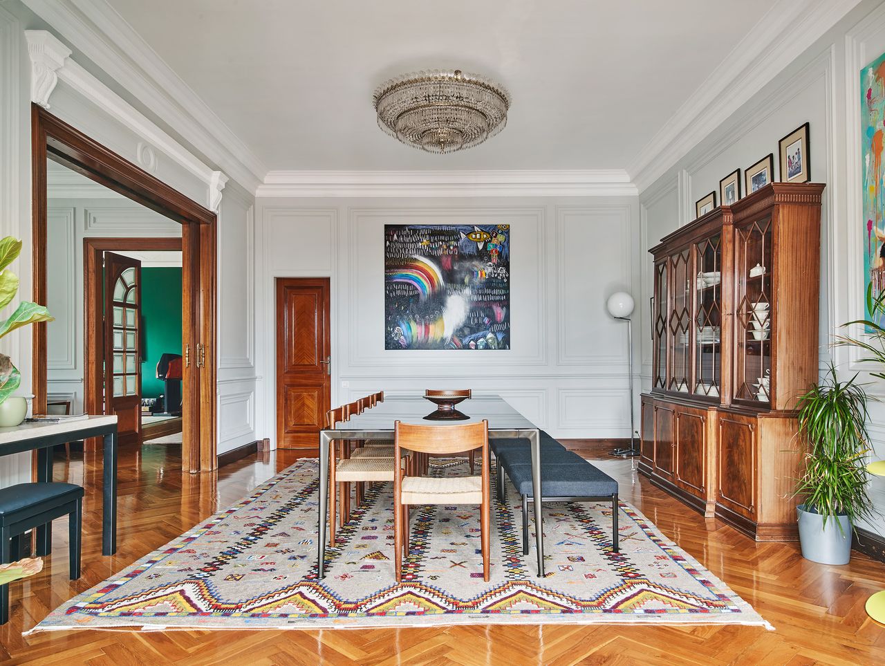 A dining table with a bench and chairs