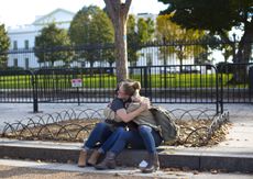 Two women embrace in front of the White House on Nov. 9, 2016. 