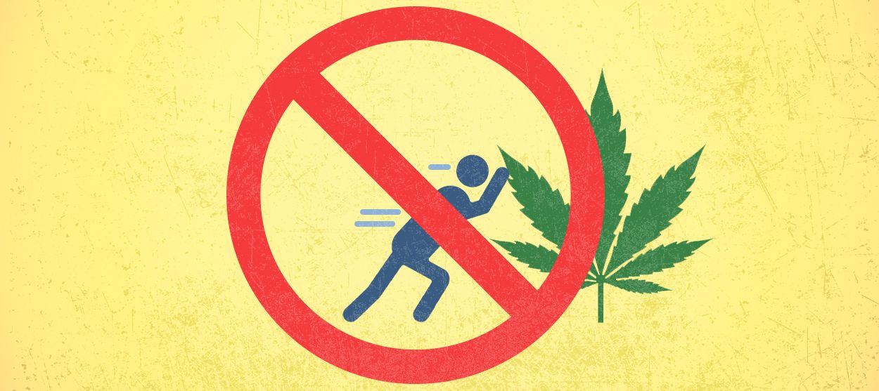 A marijuana leaf being pushed.