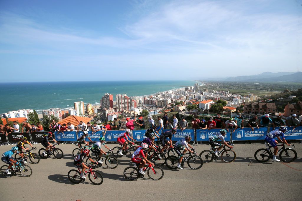 ALTO DE LA MONTAA DE CULLERA SPAIN AUGUST 19 LR Sylvain Moniquet of Belgium and Team Lotto Soudal Jos Herrada Lopez of Spain and Team Cofidis Anton Palzer of Germany Ben Zwiehoff of Germany and Team Bora Hansgrohe Anthony Roux of France and Team Groupama FDJ and a general view of the peloton climbing the Alto de la Montaa de Cullera 184m while fans cheer during the 76th Tour of Spain 2021 Stage 6 a 1583km stage from Requena to Alto de la Montaa de Cullera 184m lavuelta LaVuelta21 on August 19 2021 in Alto de la Montaa de Cullera Spain Photo by Gonzalo Arroyo MorenoGetty Images