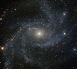 The galaxy NGC 6946, nicknamed "the Fireworks Galaxy," can be seen in this stunning image from the NASA/ESA Hubble Space Telescope. The galaxy got its explosive nickname because, while our Milky Way galaxy has an average of just 1-2 supernovas per century, NGC 6946 has had 10 in the last century. "The Fireworks Galaxy," the structure of which is somewhere between a full spiral and a barred spiral, can be found 25.2 million light-years from Earth on the border of the constellations Cepheus and Cygnus. -- Chelsea Gohd