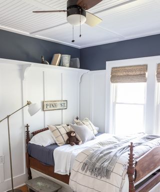 Country bedroom with beadboard ceilings and ceiling fan